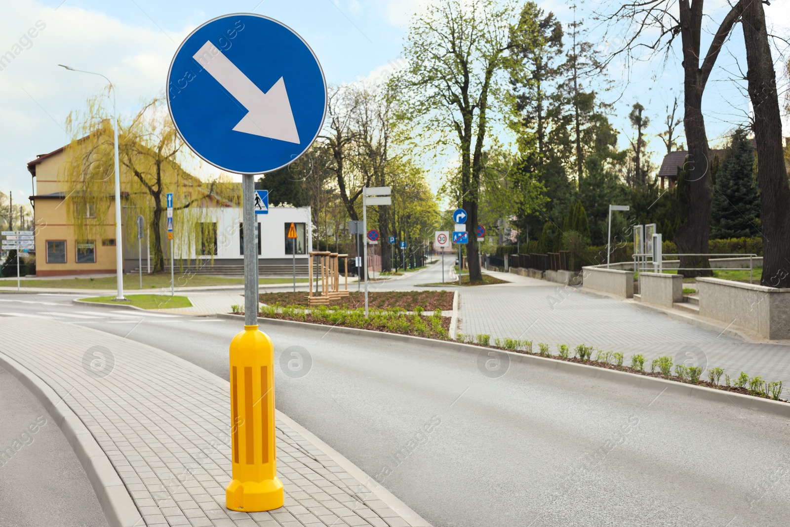 Photo of Traffic sign Keep Right on city street, space for text