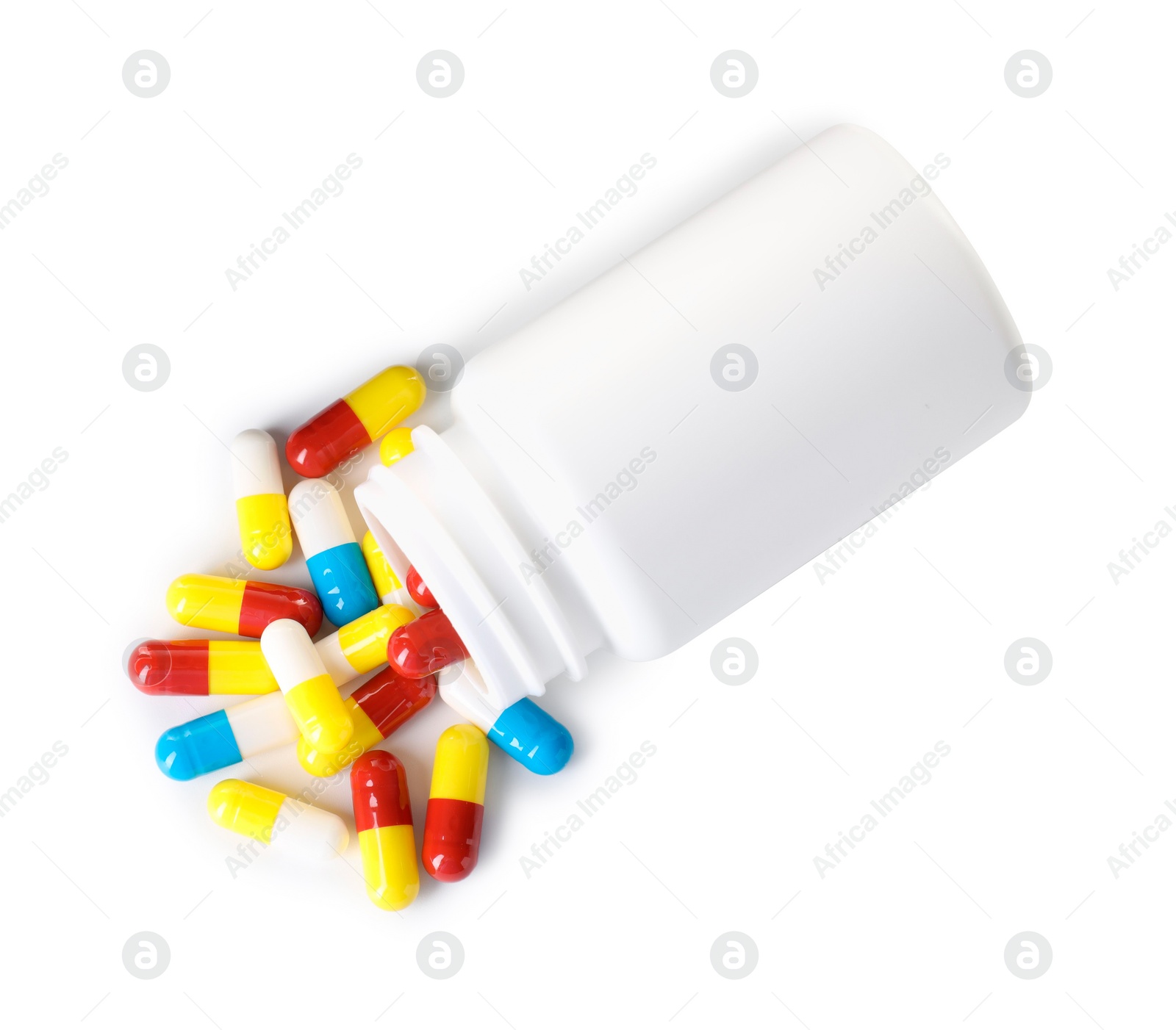 Photo of Antibiotic pills and bottle isolated on white, top view