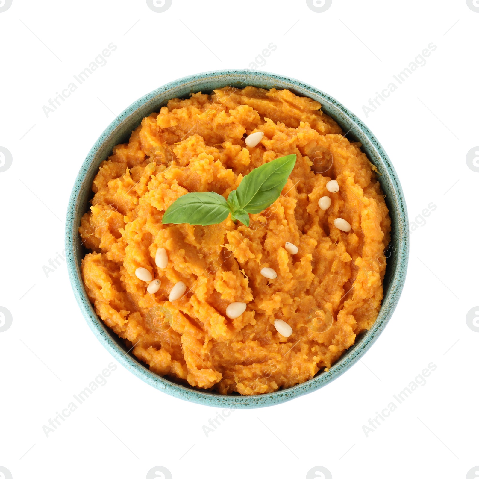 Photo of Bowl with mashed sweet potatoes on white background, top view