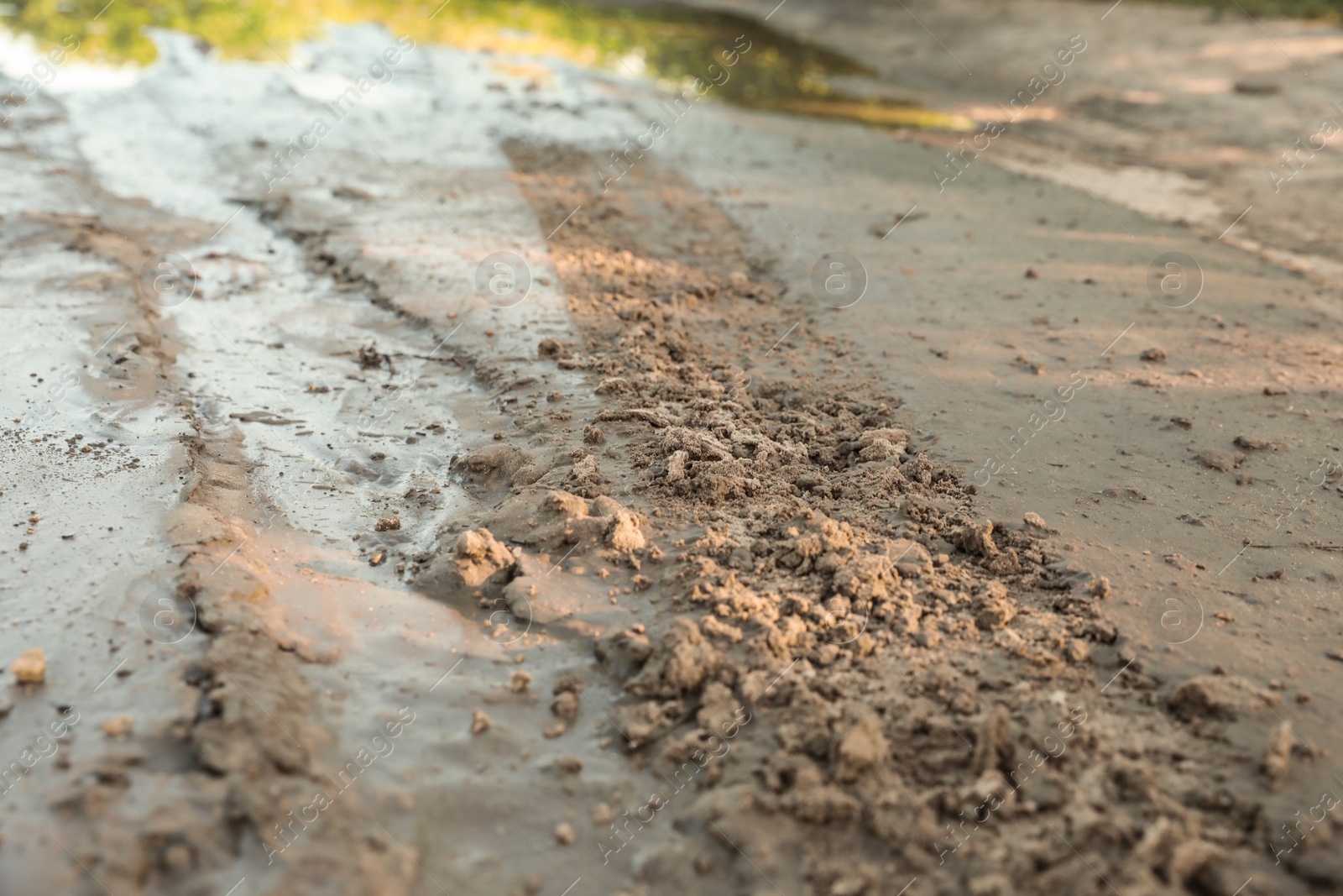 Photo of View of textured ground mud outdoors on sunny day