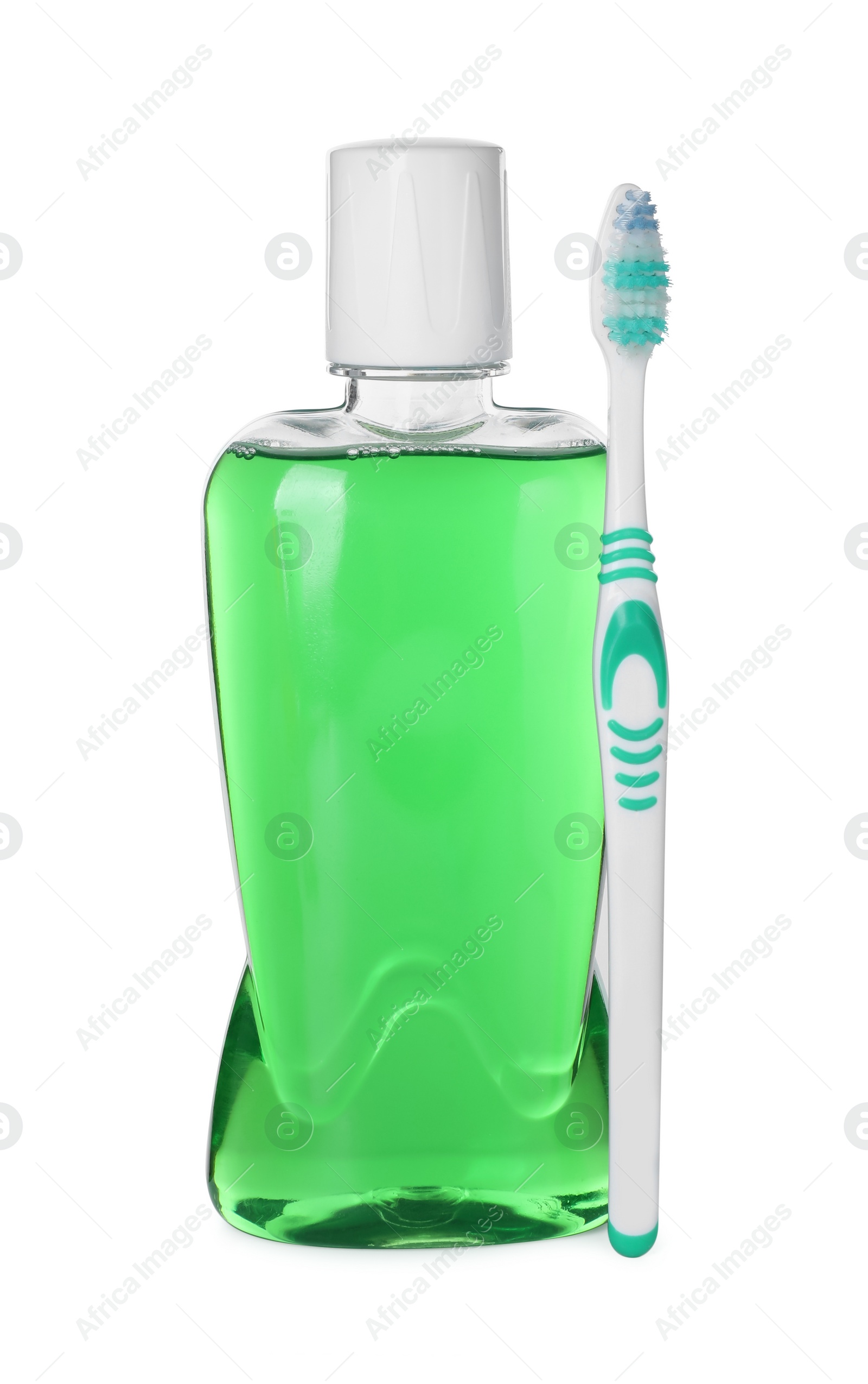 Photo of Bottle of mouthwash and toothbrush isolated on white