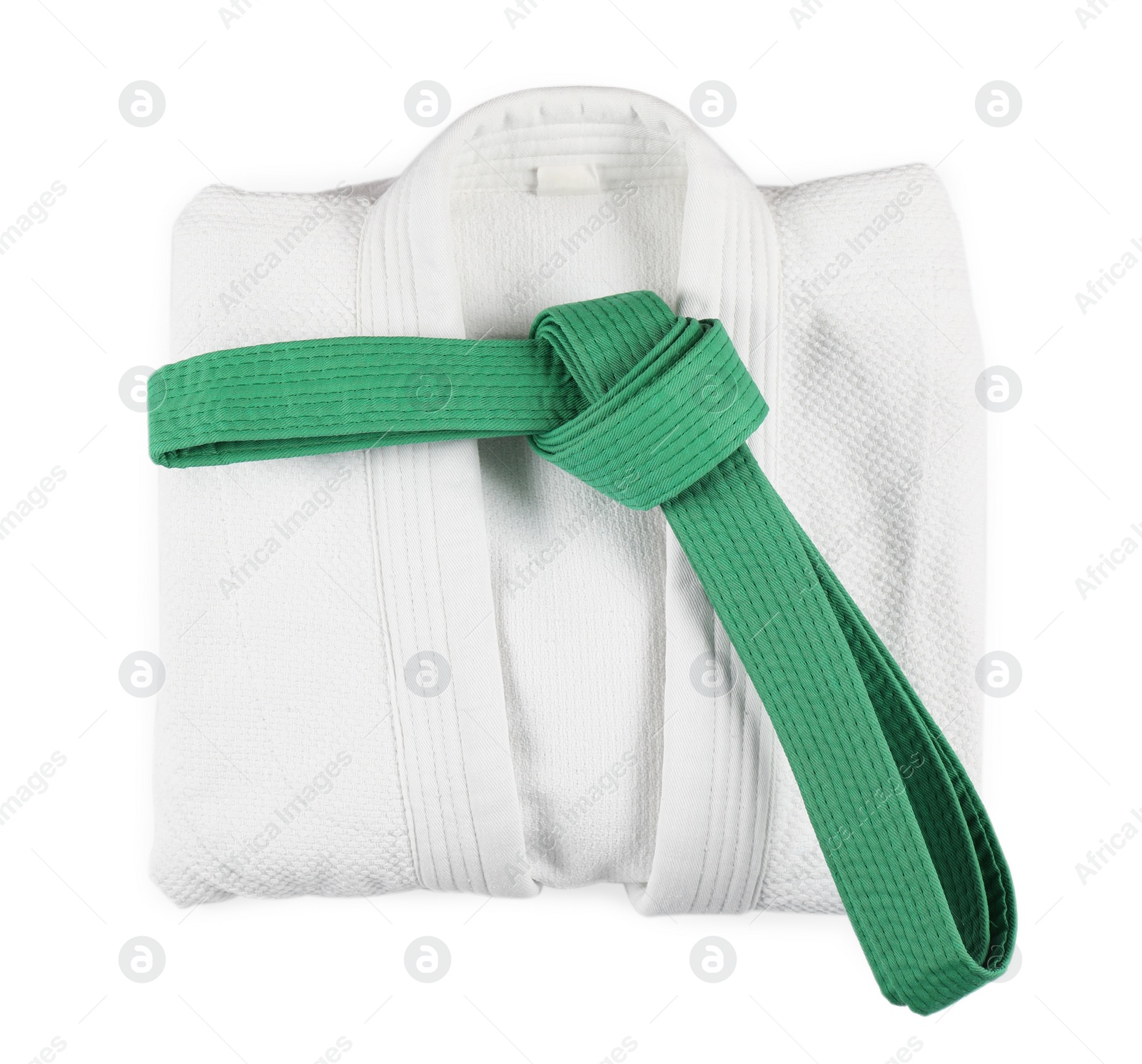 Photo of Martial arts uniform with green belt isolated on white, top view