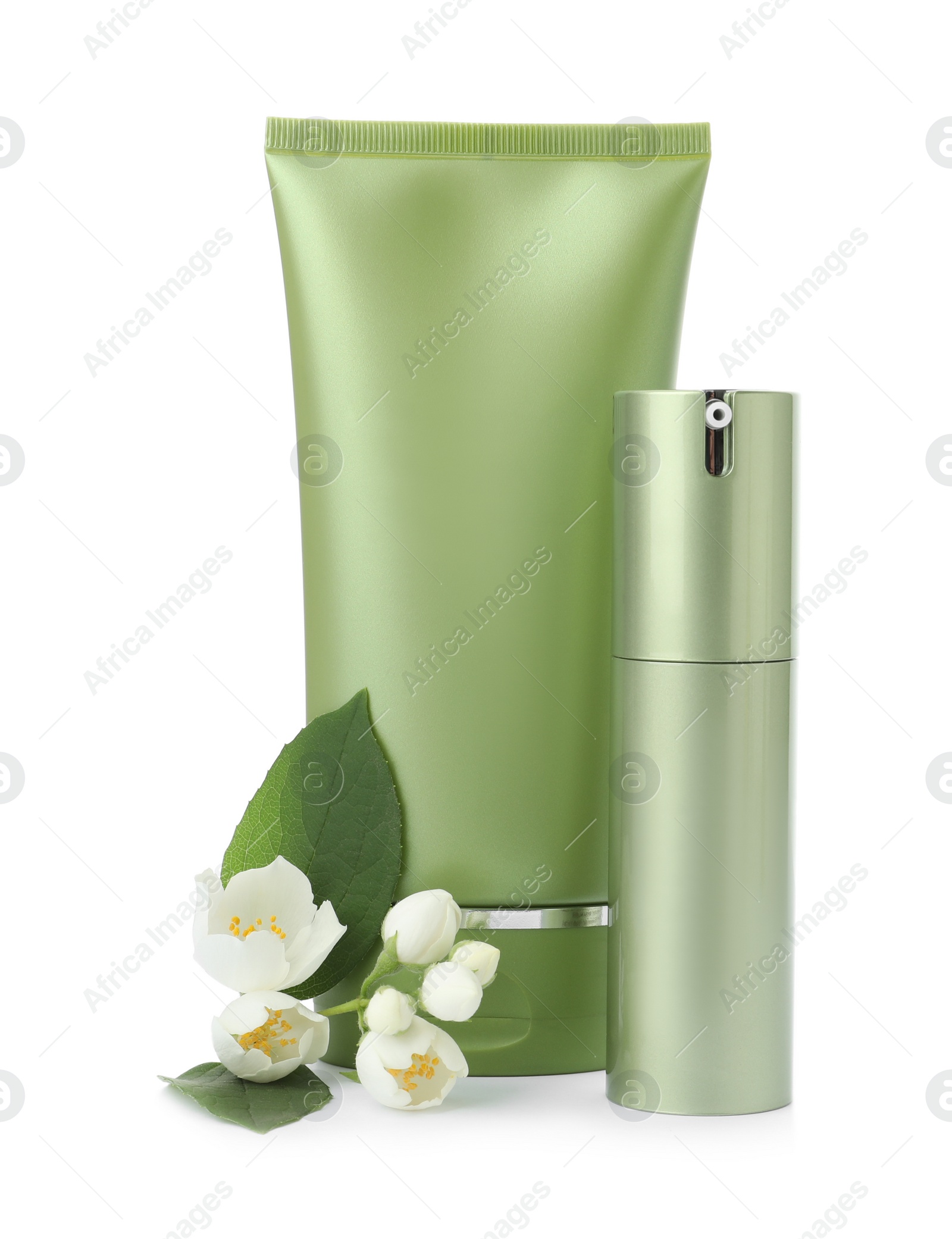 Photo of Cosmetic products and flowers isolated on white