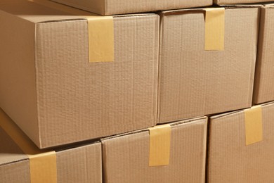Photo of Stack of many cardboard boxes as background. Packaging goods