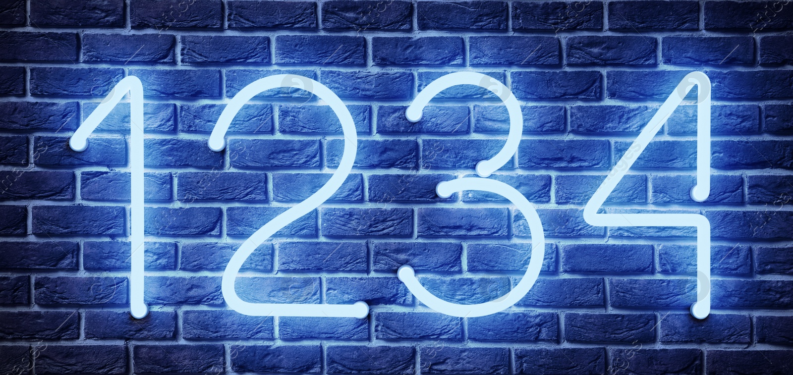 Image of Glowing neon number (1, 2, 3, 4) signs on brick wall