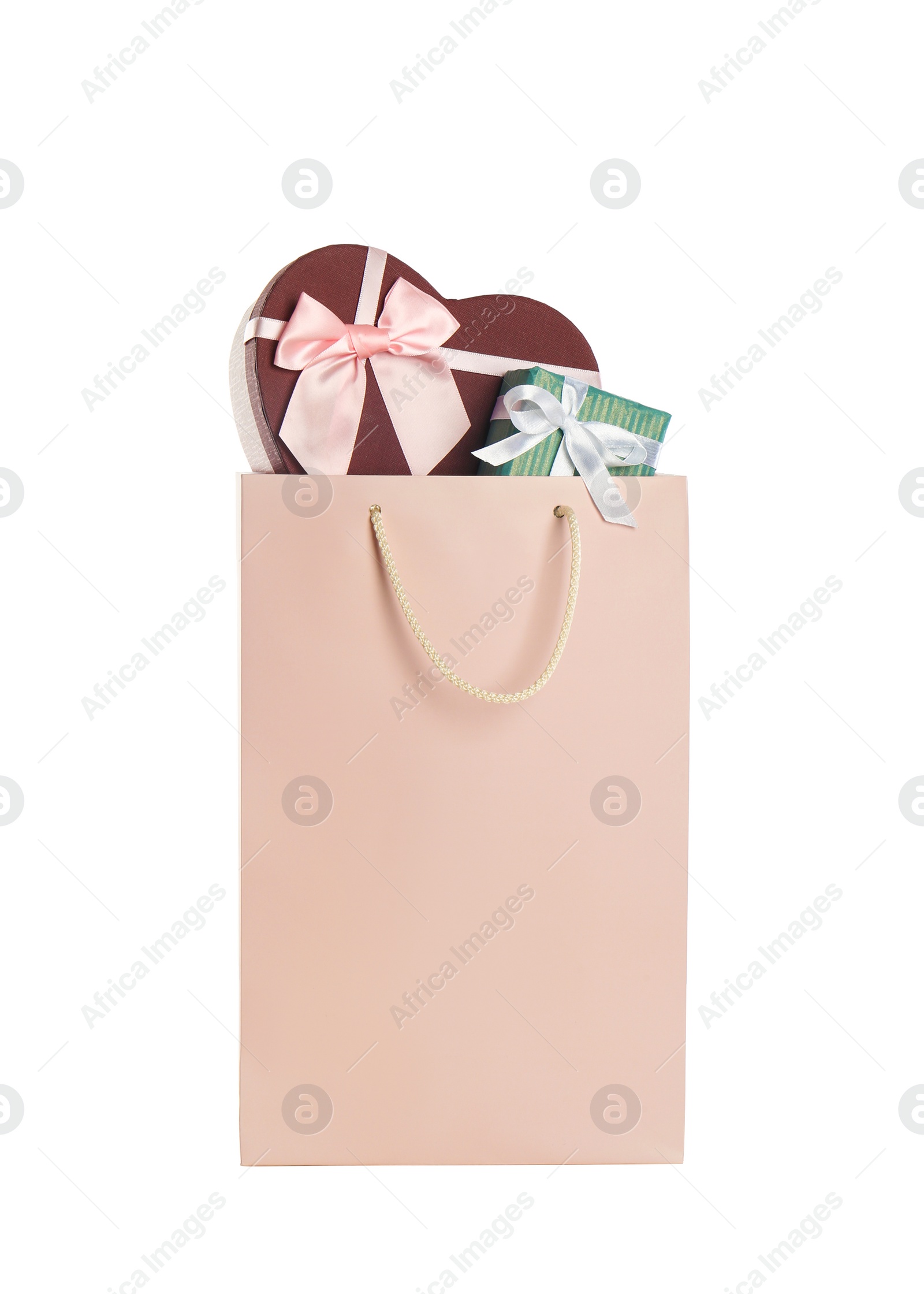 Photo of Paper shopping bag full of gift boxes isolated on white