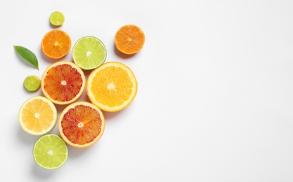 Photo of Composition with different citrus fruits on white background, top view