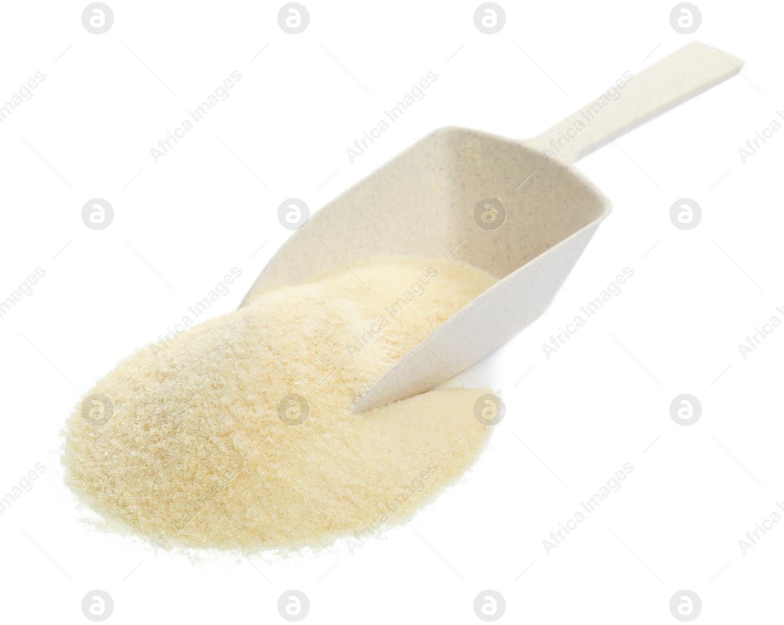 Photo of Pile of gelatin powder and scoop on white background