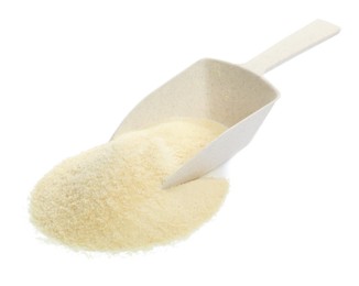 Photo of Pile of gelatin powder and scoop on white background