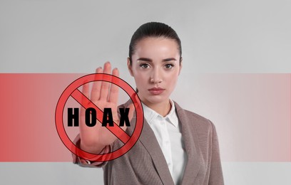 Information hygiene. Woman showing stop gesture with prohibition sign and word Hoax on light grey background