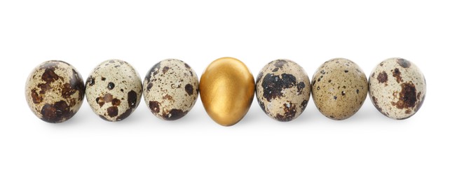 Photo of Golden egg and quail ones on white background