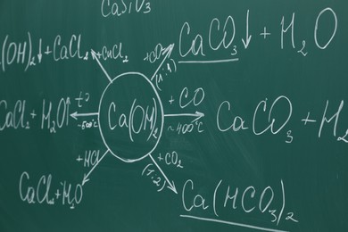 Photo of Chemical formulas written with chalk on green board