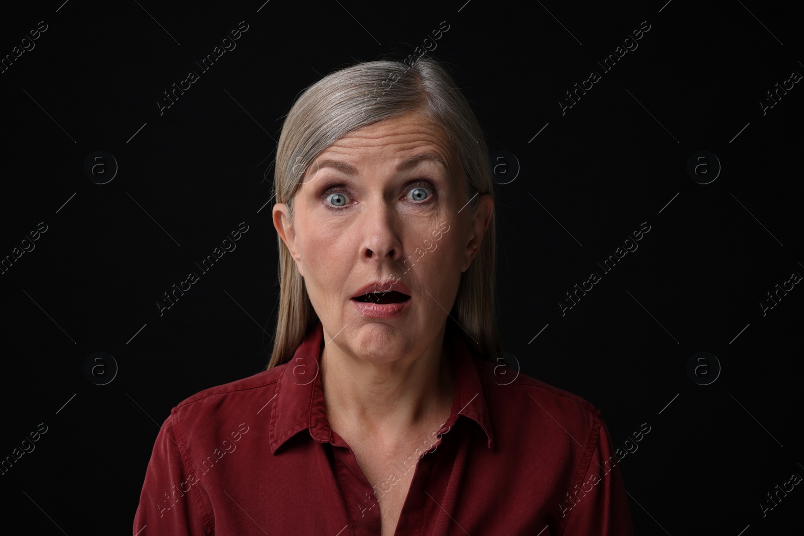 Photo of Personality concept. Portrait of emotional woman on black background