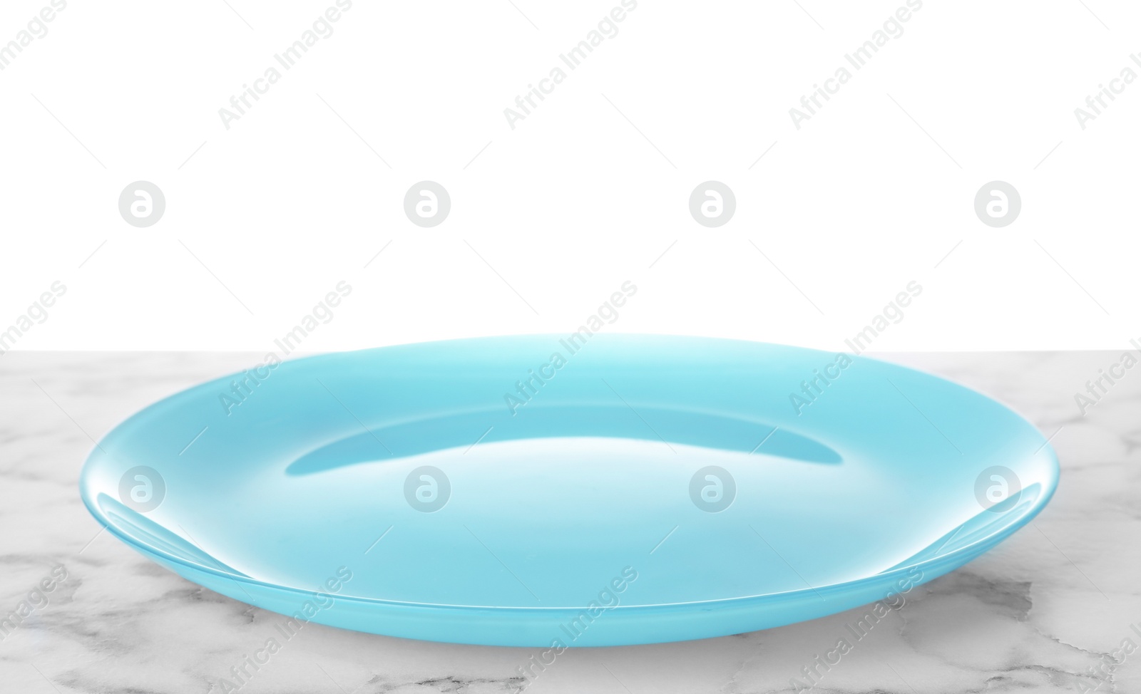 Photo of Clean empty plate on marble table against white background