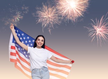 Image of 4th of July - Independence day of America. Happy woman holding national flag of United States against sky with fireworks