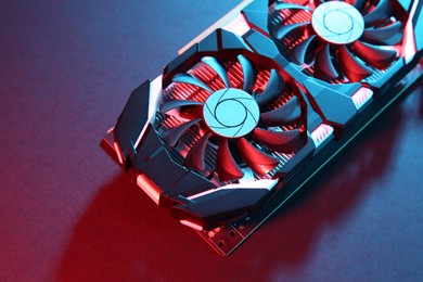 Photo of Computer graphics card on color background, closeup. Space for text