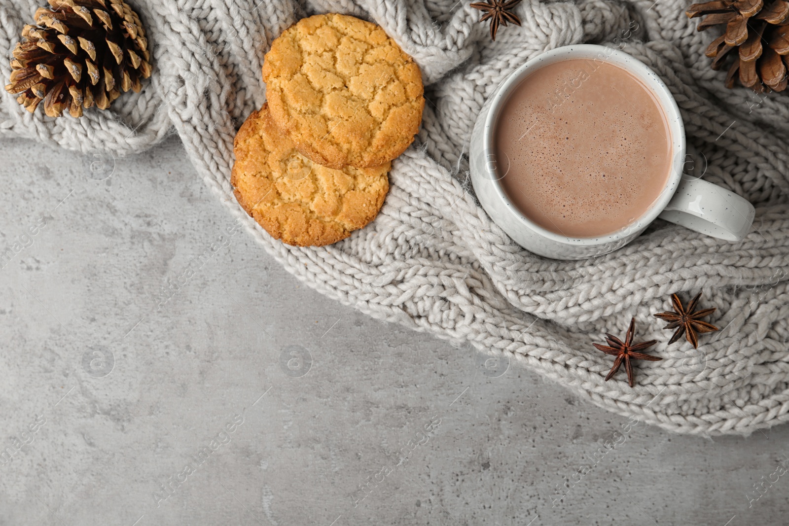 Photo of Composition with delicious hot cocoa drink and cookies on grey background, flat lay