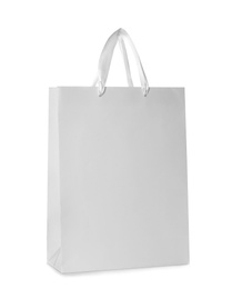 Photo of Paper shopping bag isolated on white. Mock up for design