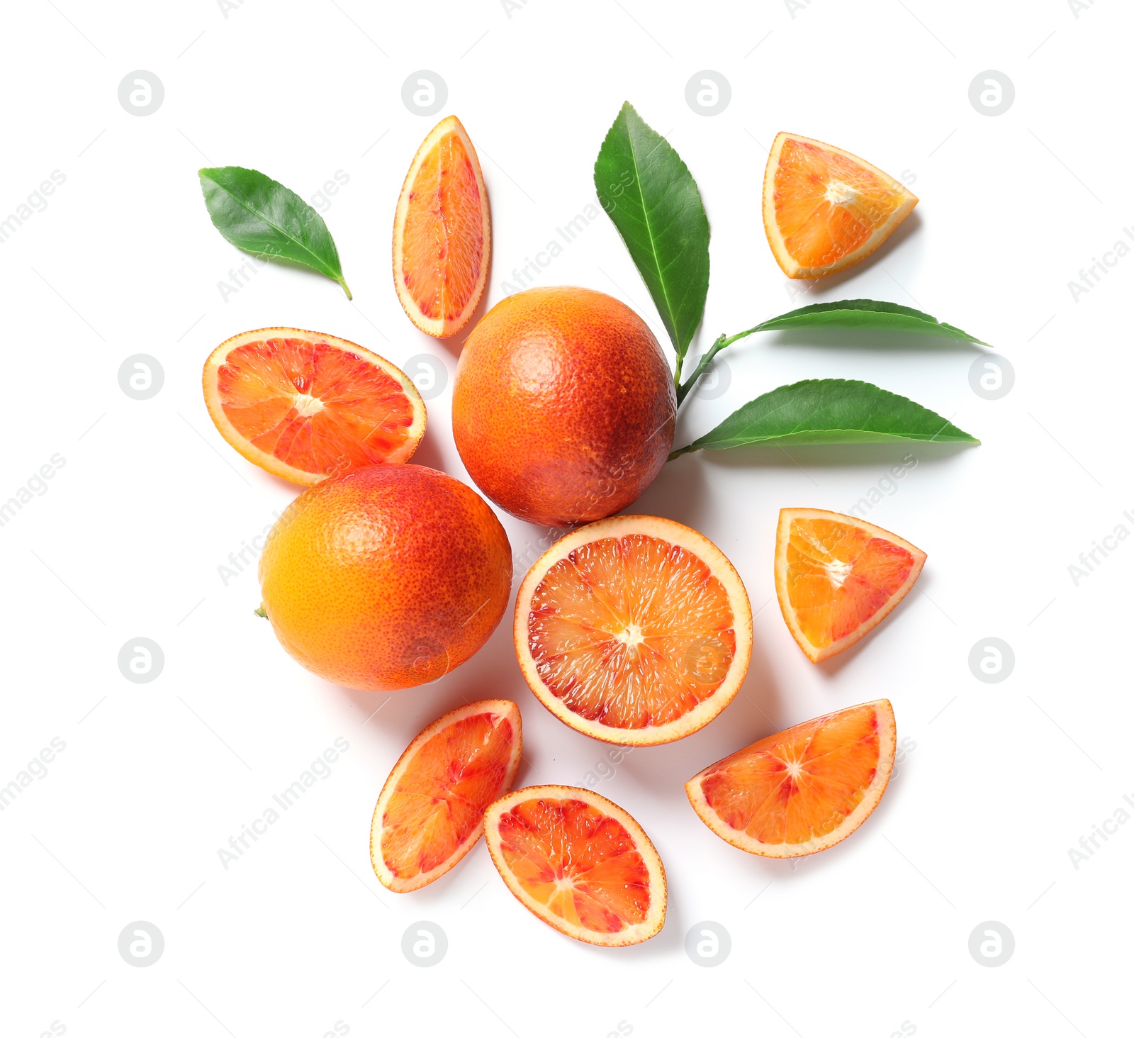 Photo of Fresh bloody oranges and leaves on white background, top view. Citrus fruits