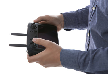 Man holding new modern drone controller on white background, closeup of hands