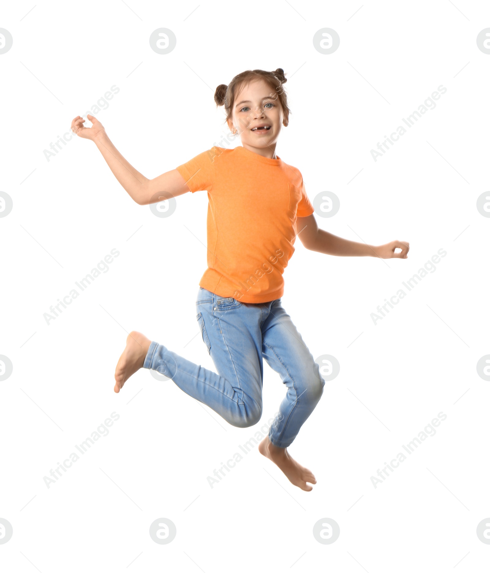 Photo of Cute little girl jumping on white background