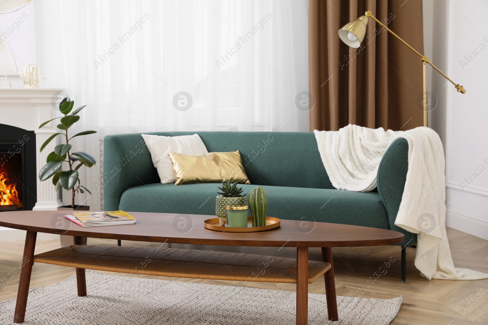 Photo of Stylish living room interior with comfortable sofa and wooden table