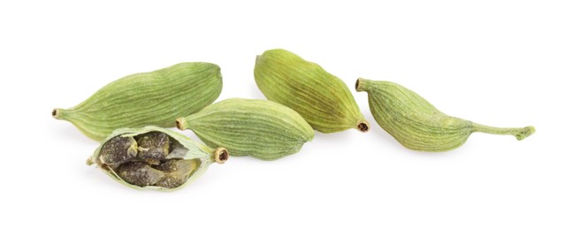Pile of dry green cardamom pods isolated on white