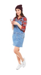 Attractive young woman using mobile phone on white background