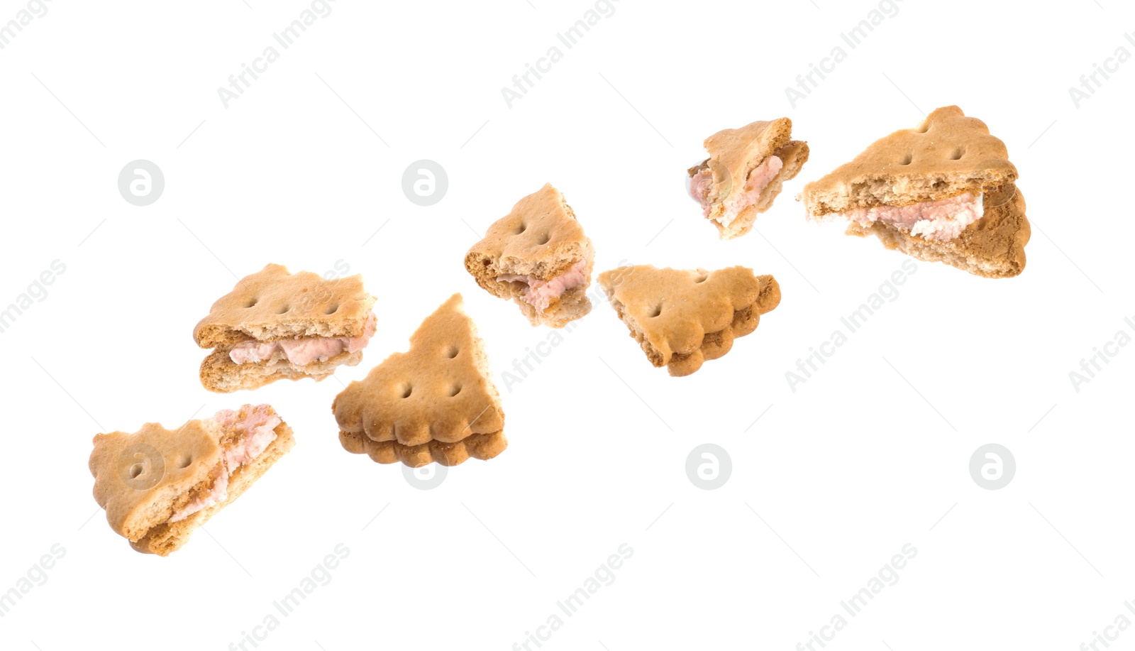 Photo of Pieces of tasty sandwich cookie with cream on white background