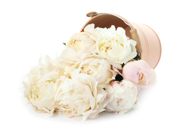 Photo of Overturned bucket with peonies on white background