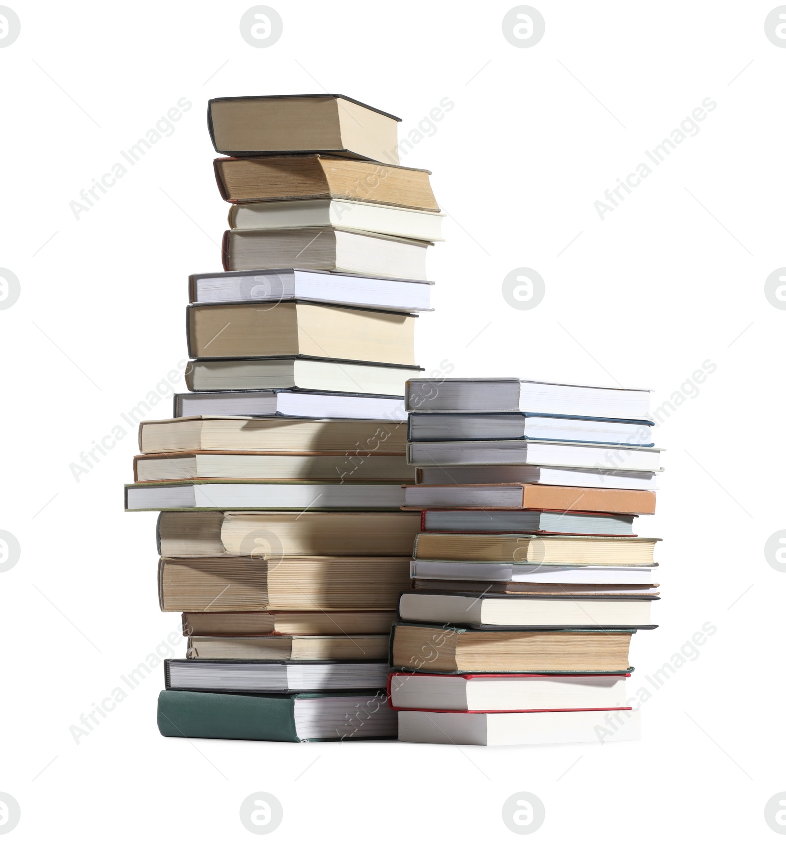 Photo of Stacks of many different books isolated on white