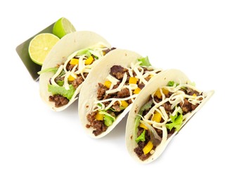 Delicious tacos with fried meat, cheese and lime on white background
