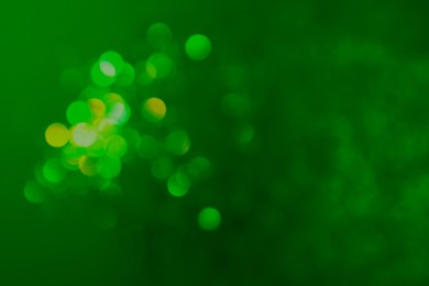 Image of St. Patrick day. Green background with blurred lights, bokeh effect