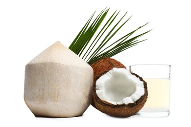 Photo of Glass of coconut milk and nuts on white background