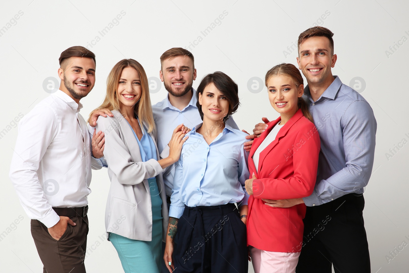 Photo of Group of young people on light background. Teamwork concept