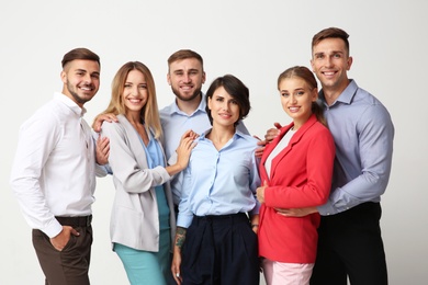 Group of young people on light background. Teamwork concept