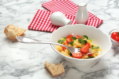 Bowl with delicious pasta primavera on table