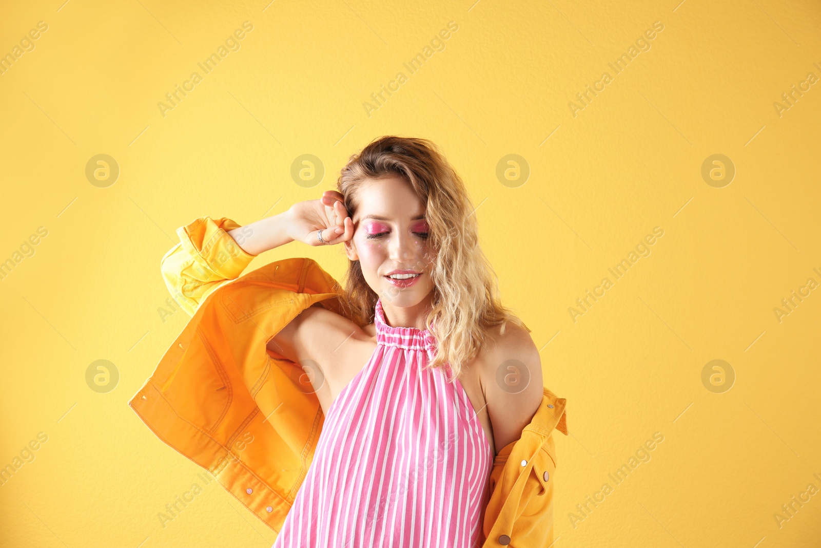 Photo of Beautiful young woman posing on color background. Summer fashion