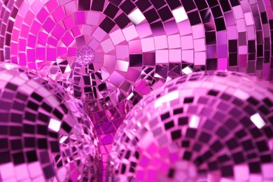Photo of Many shiny disco balls as background, closeup