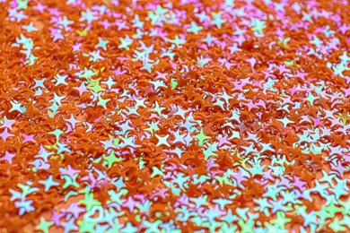 Photo of Shiny bright glitter as background, closeup view