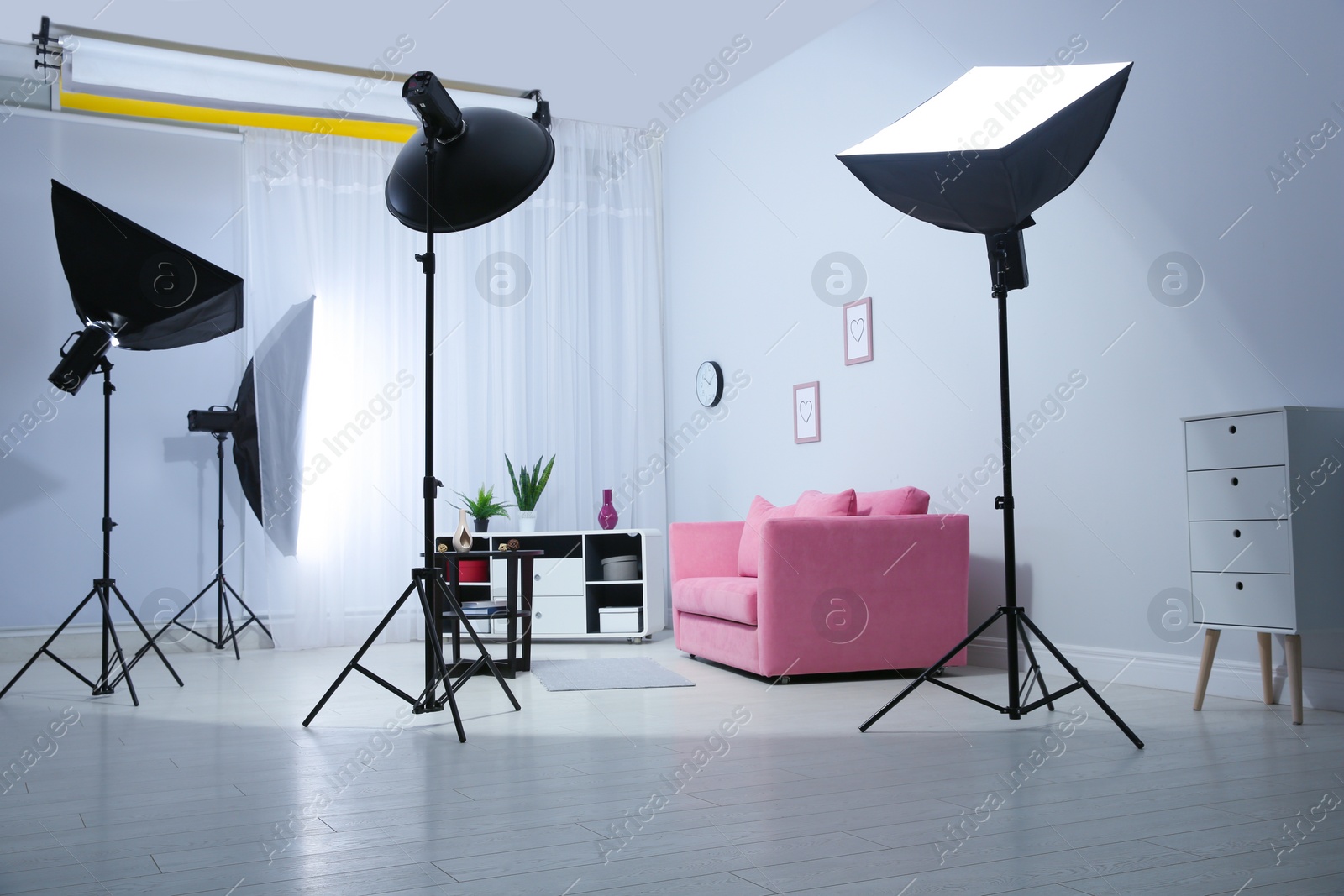 Photo of Example of living room interior design and professional equipment in photo studio