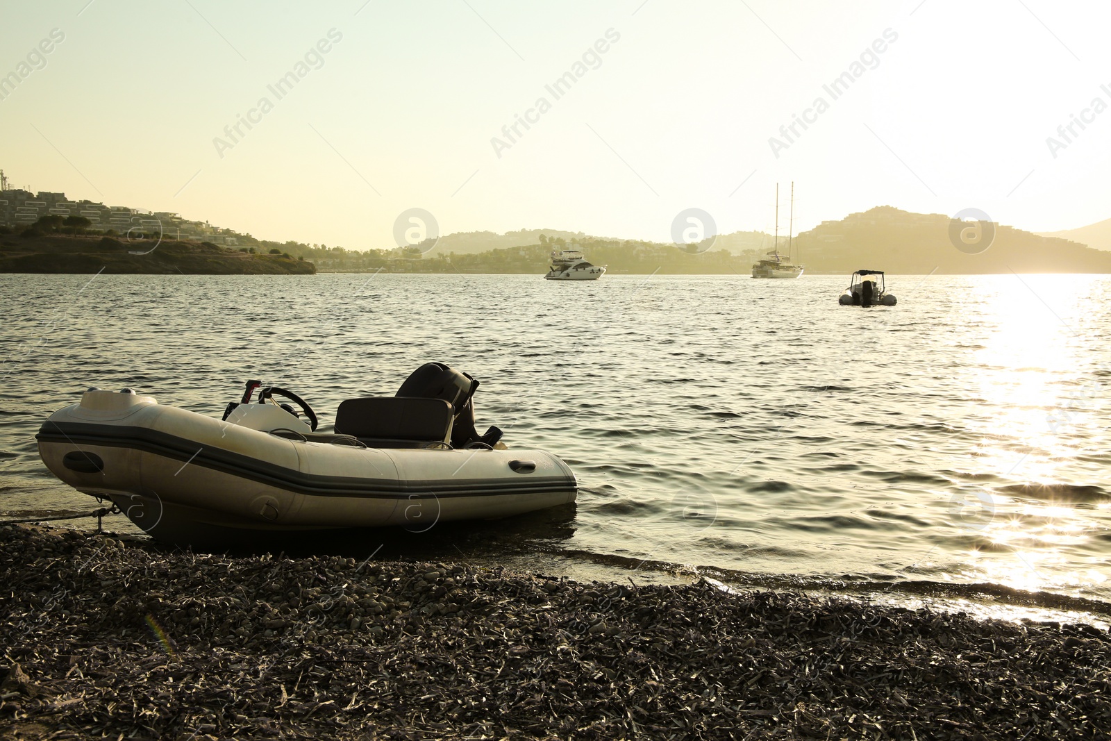 Photo of Beautiful view of calm sea, boats and coastal city on sunny day