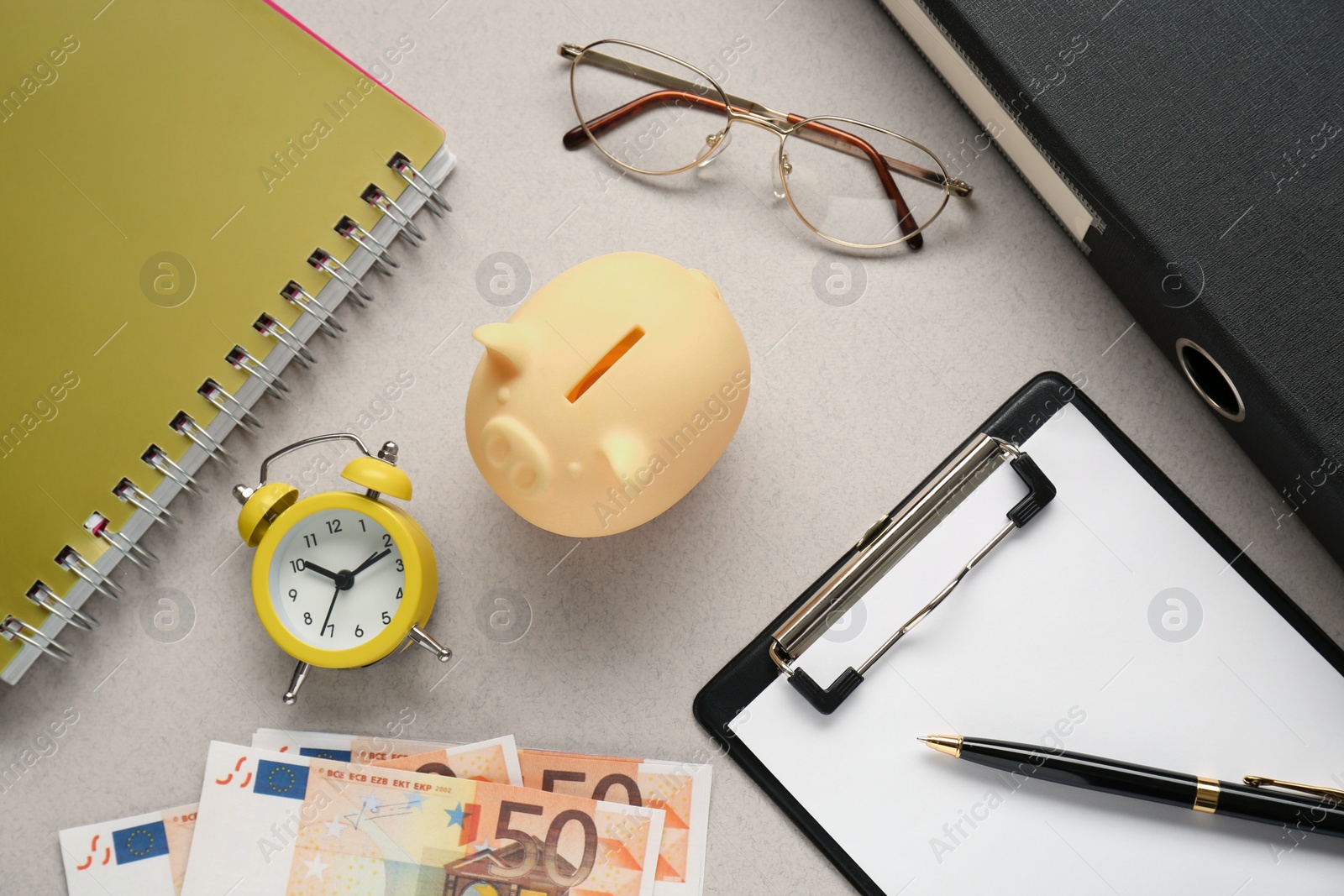 Photo of Flat lay composition with piggy bank and banknotes on grey background