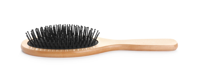 New wooden hair brush isolated on white