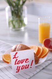 Photo of Romantic breakfast with note saying I Love You on table