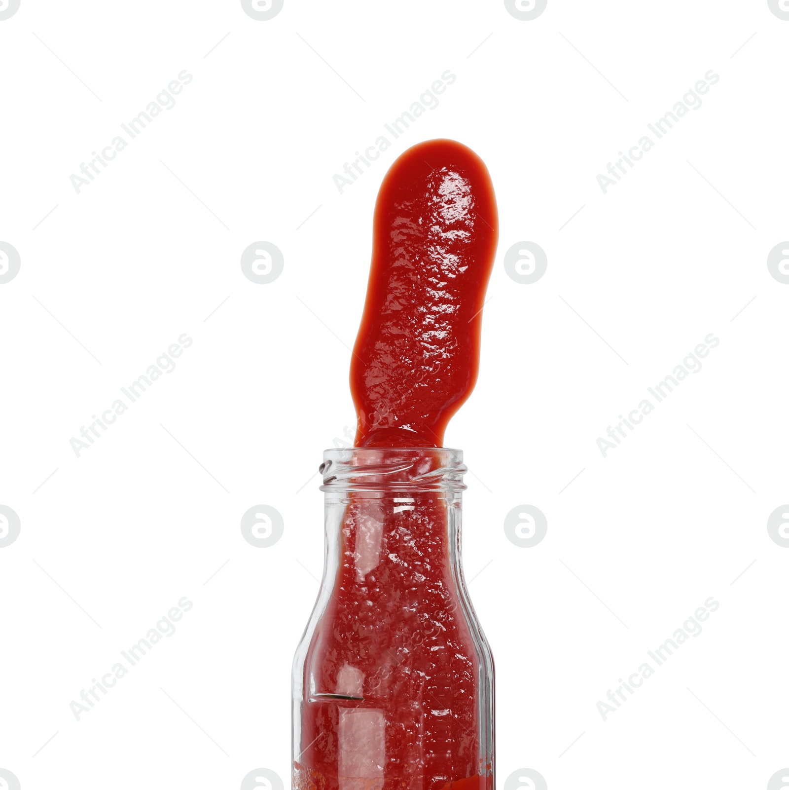 Photo of Ketchup and glass bottle isolated on white, top view