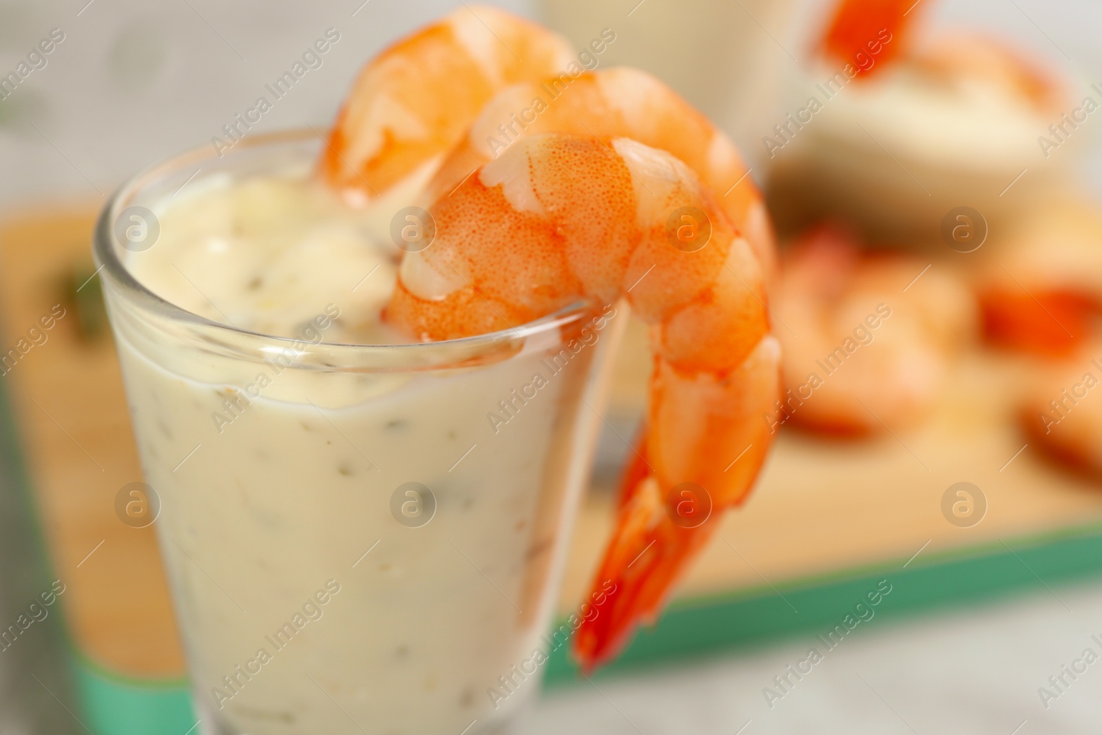 Photo of Delicious shrimp cocktail and tartar sauce, closeup