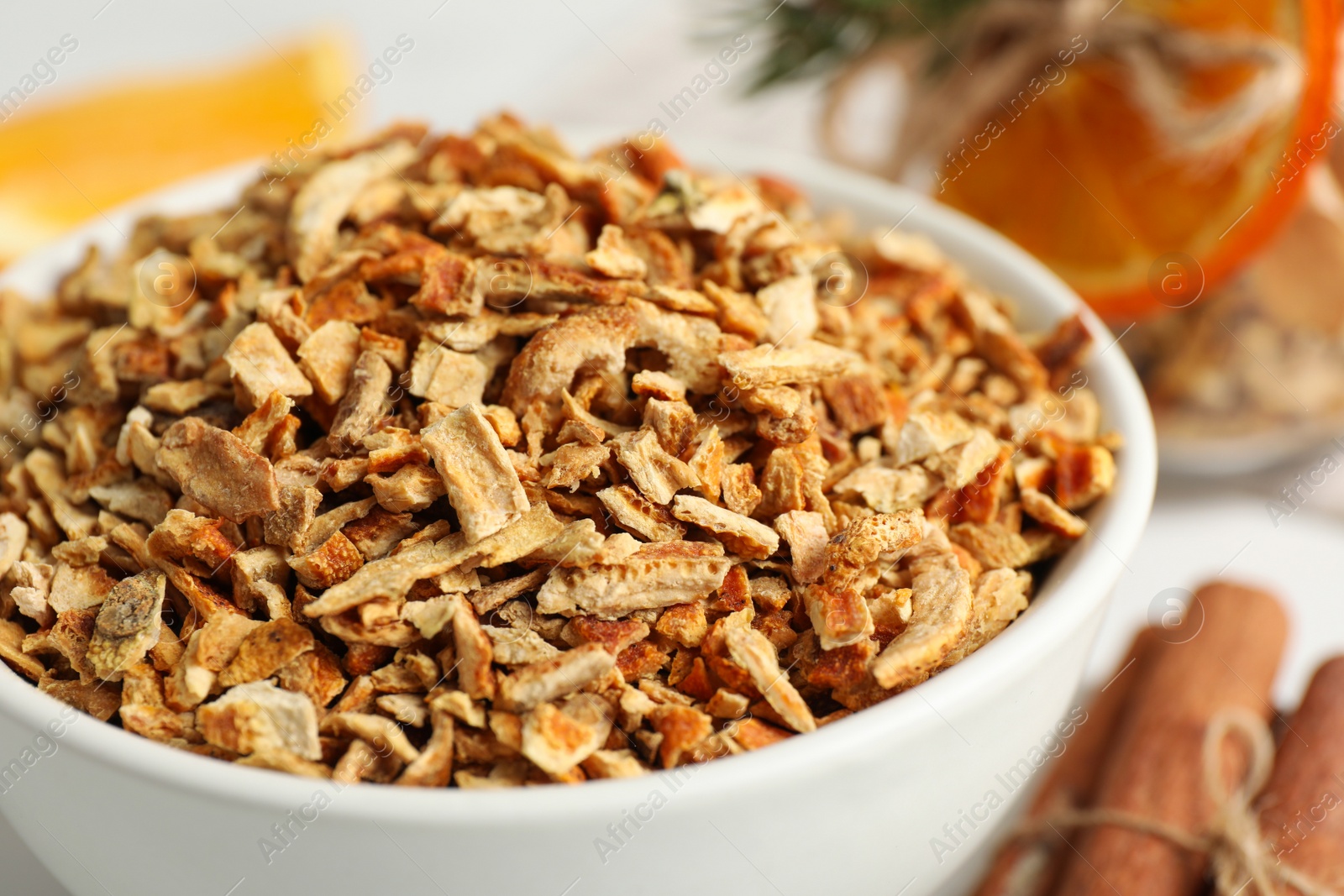 Photo of Bowl of dried orange zest seasoning, closeup