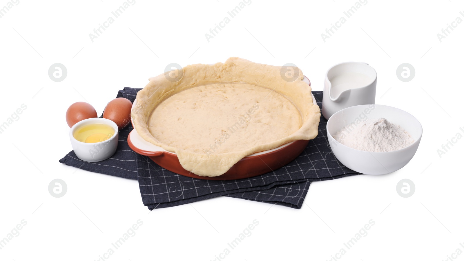 Photo of Quiche pan with fresh dough and ingredients isolated on white