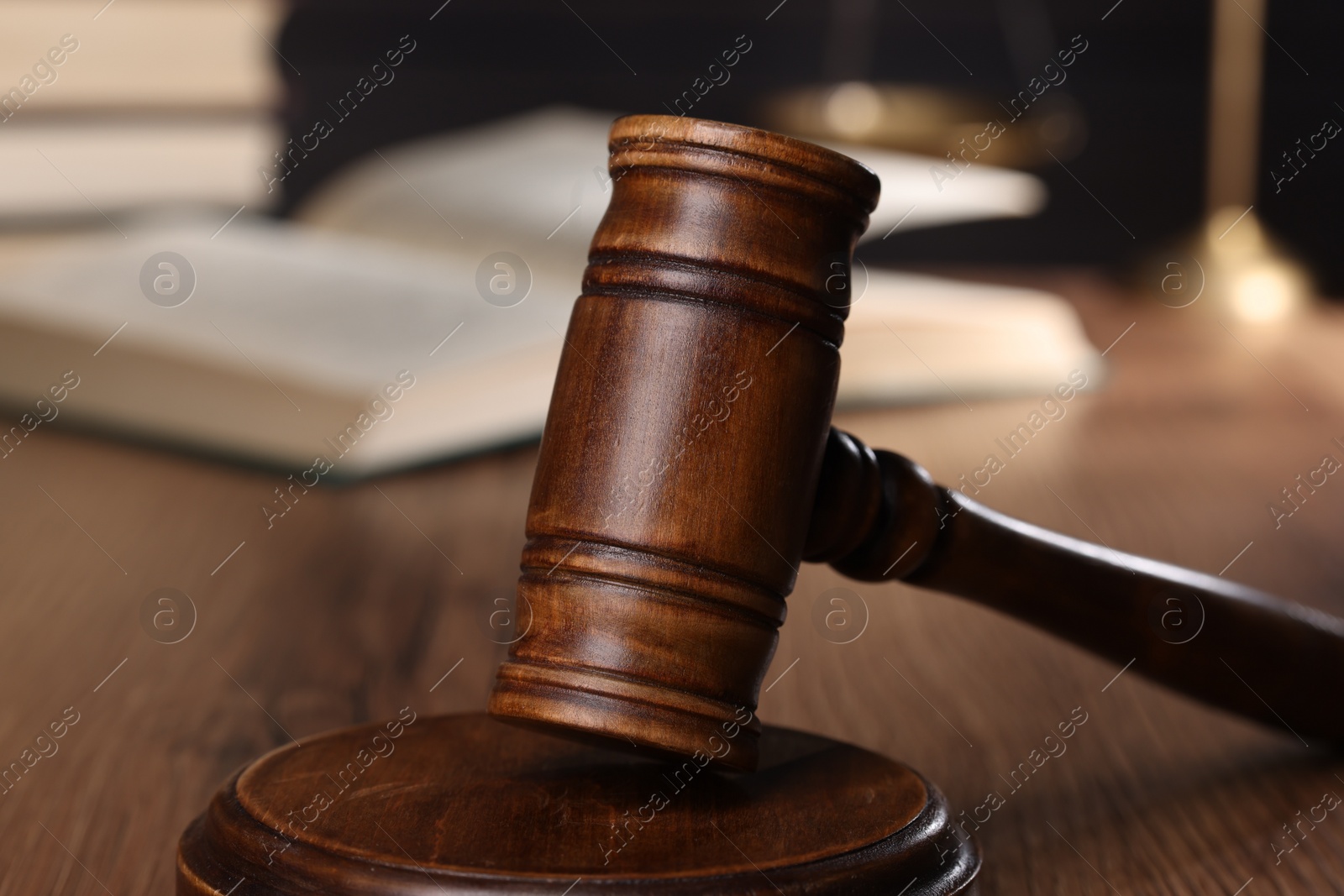 Photo of Law concept. Judge's gavel on wooden table, closeup